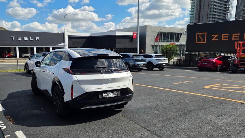 White Zeekr X viewed from the rear outside the dealership